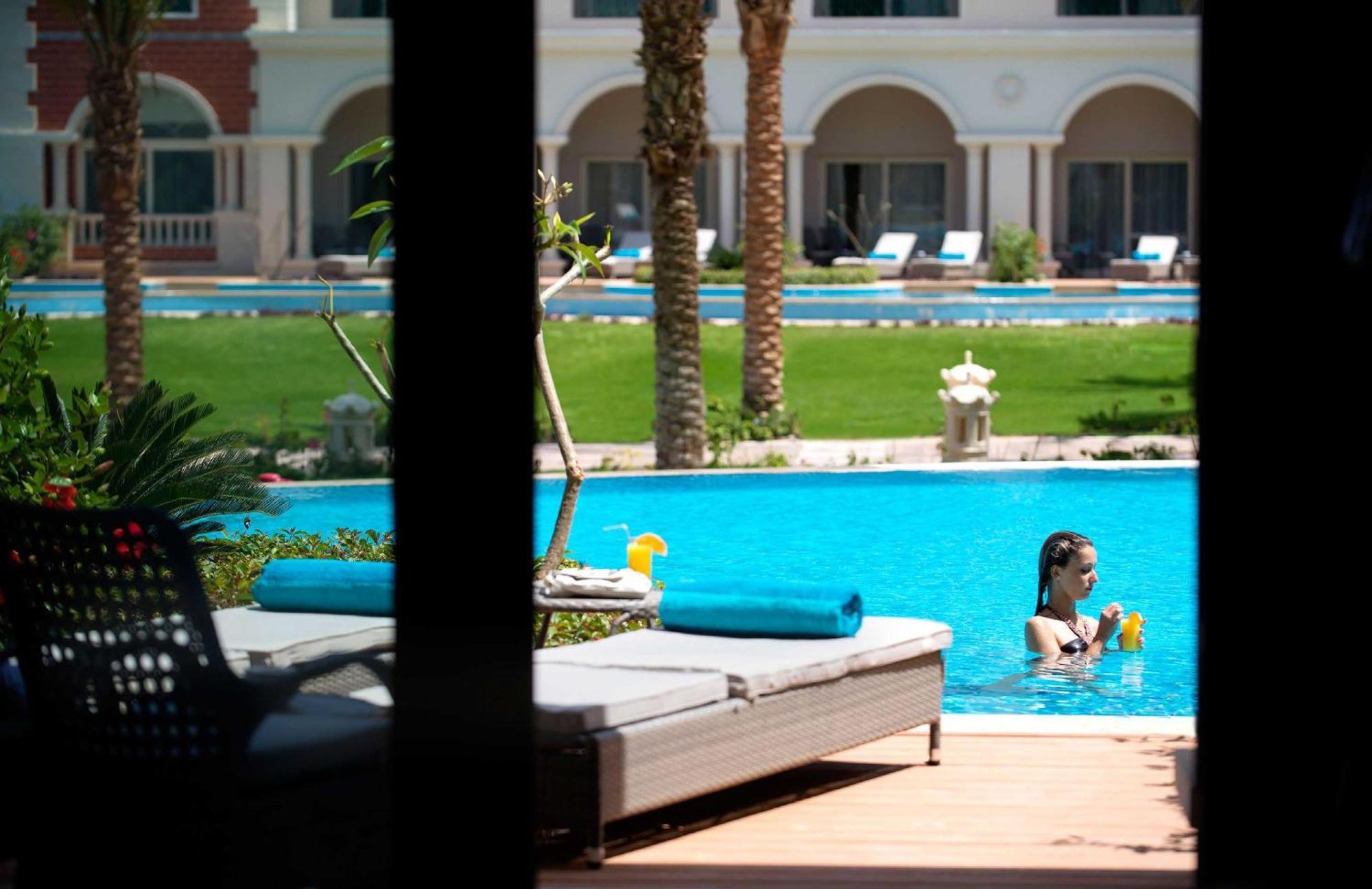 Baron Palace Sahl Hasheesh Hurghada Esterno foto The swimming pool at the hotel